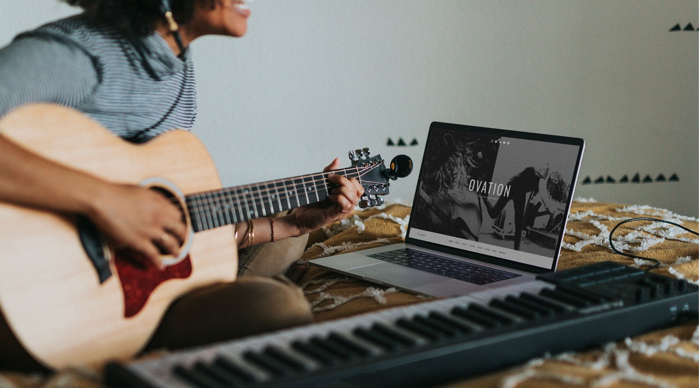 Stylized image of a guy playing guitar with the Ovation theme on a laptop.